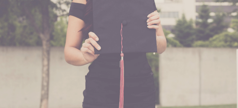 Woman Holding Graduation Cap