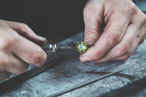 Man repairing gemstone ring