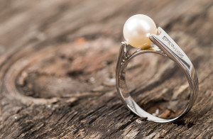 Pearl Ring on Wooden Plank